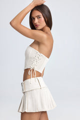 Devora-Belted Pleated Low-Rise Micro Mini Skirt in Ecru