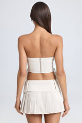 Devora-Belted Pleated Low-Rise Micro Mini Skirt in Ecru
